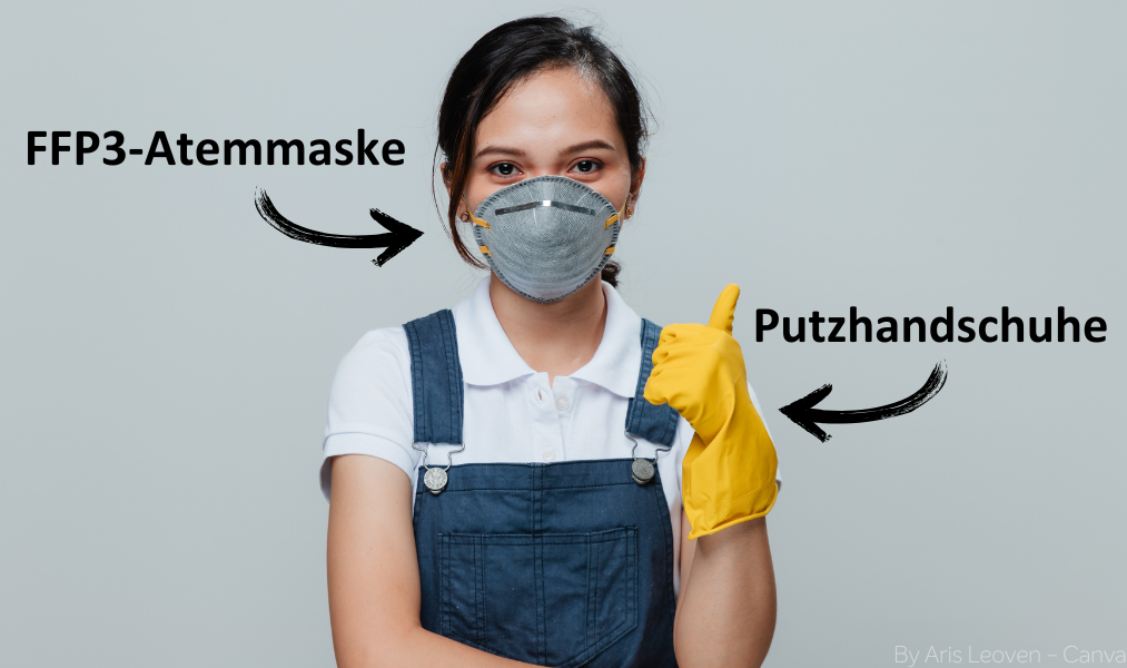 Frau mit FFP3-Maske und Putzhandschuhen in der Hand.