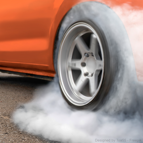 oranges Auto mit durchdrehenden Reifen